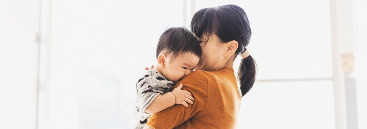 Asian mother holding her baby