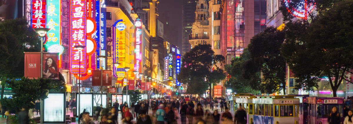 Crowded chinese street at night with neon lights