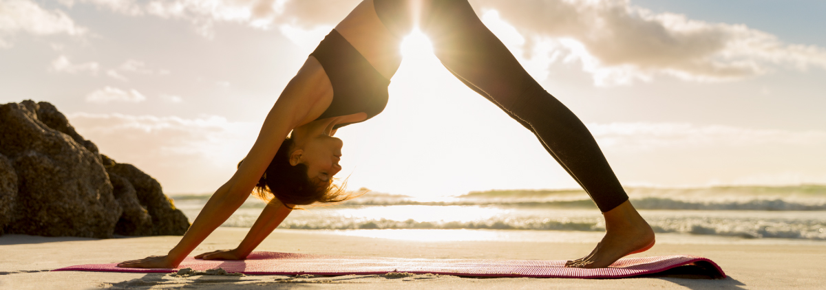 Woman doing downward facing dog yoga position