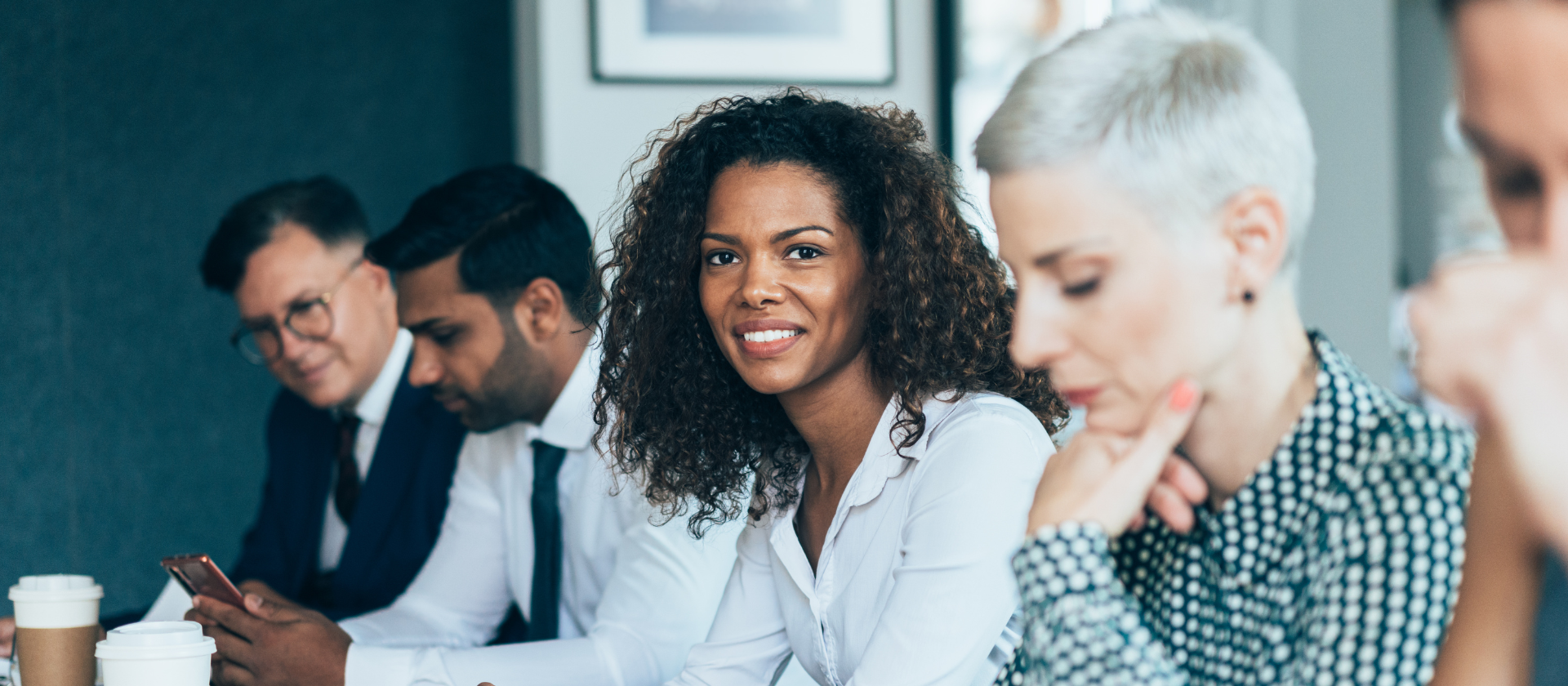 Multiethnic business team sitting at a table