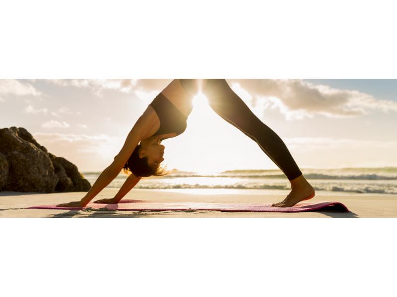 Woman doing downward facing dog yoga position