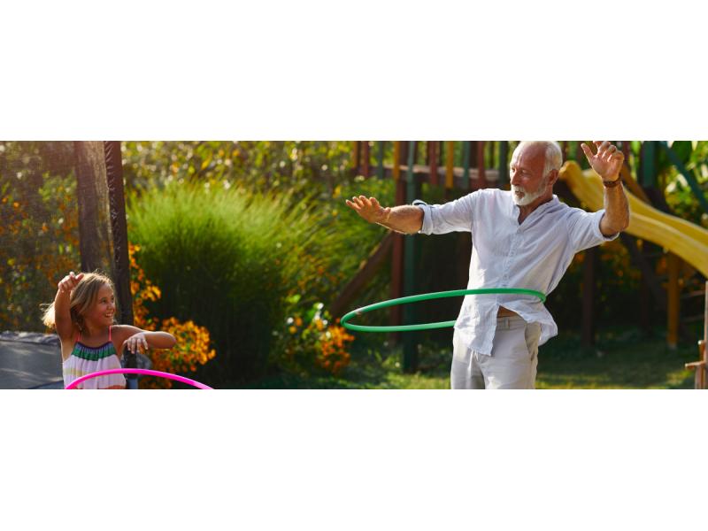 Grandfather and daughter hooping together outdoor